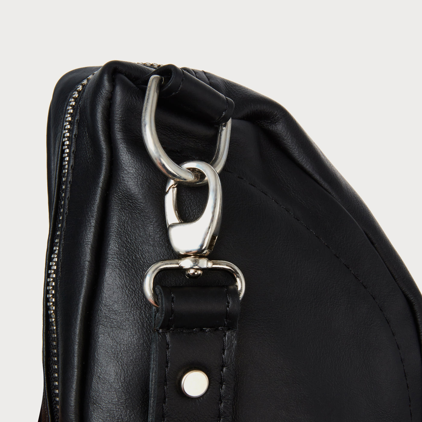 Hair-on-hide. YKK zip. Italian clips.