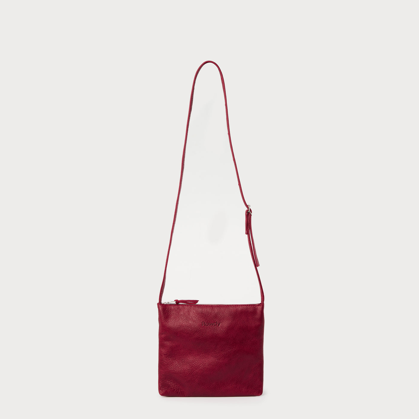 Lined interior. Italian zip. Adjustable strap.