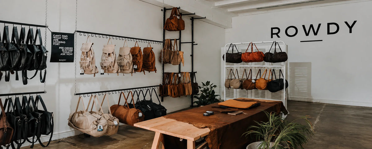 Inside a Rowdy store in Cape Town with leather bags on the wall