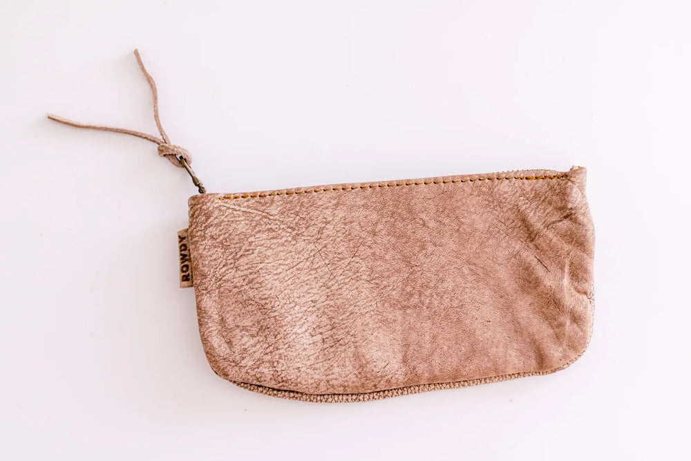 Rowdy Boulder leather Travel Pouch worn with the adjustable crossbody strap