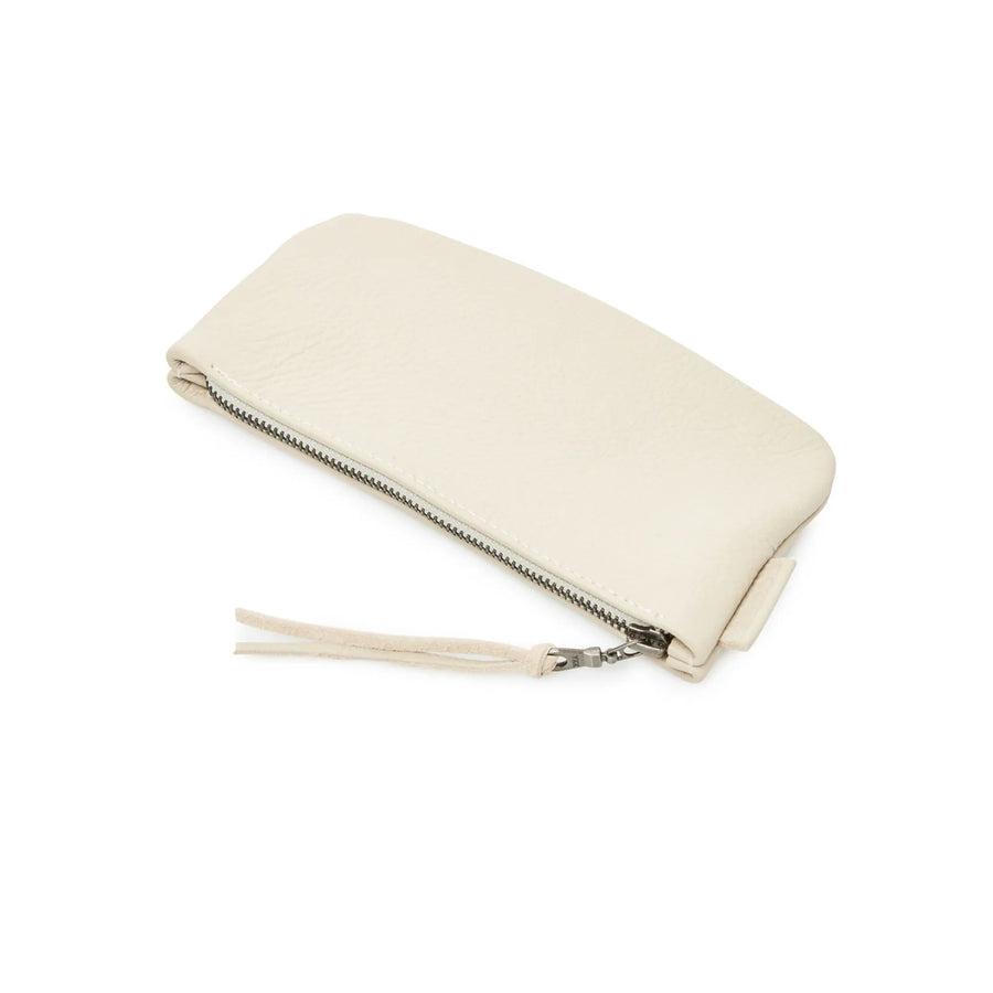 Rowdy Stone leather Travel Pouch worn with the adjustable crossbody strap